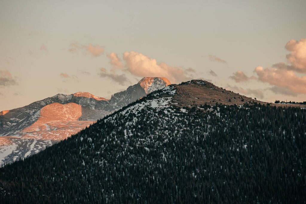 Landscape of Long's Peak in Rocky Mountain National Park in Colorado. Sunset is turning the mountain pink.